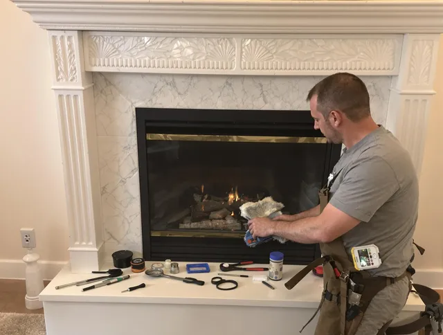 Plainville Chimney Sweep performing fireplace maintenance in Plainville, CT